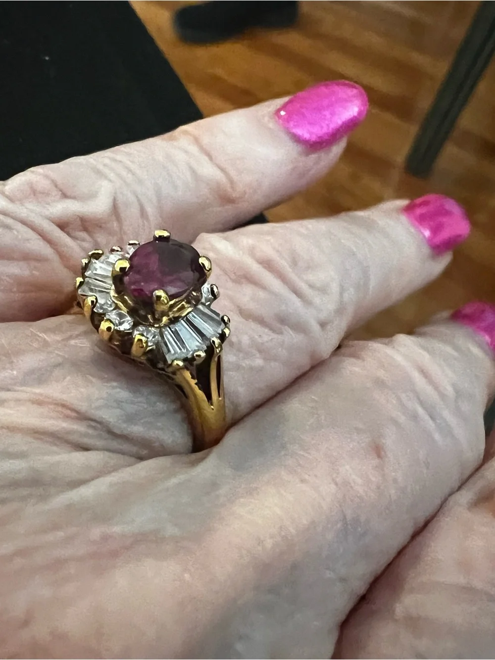 Gold Ring with Ruby-Red Center and Clear Accent Stones